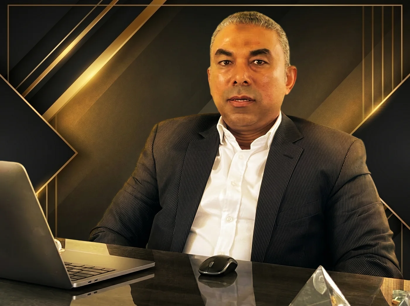 Mohsen Aly seated at his desk
