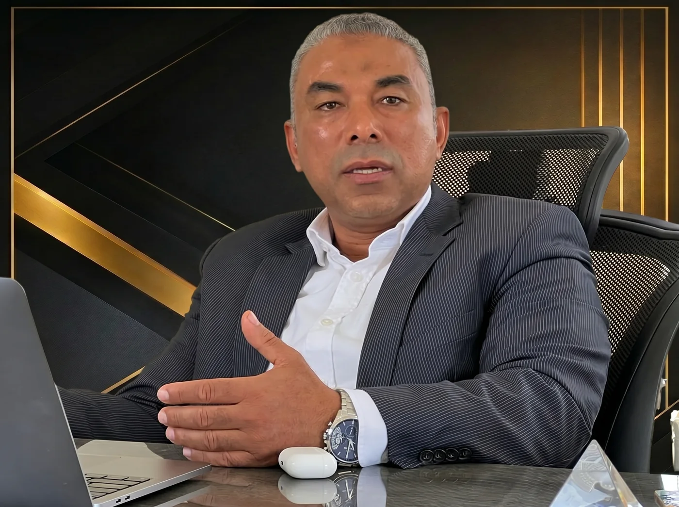 Mohsen Aly in discussion at his desk